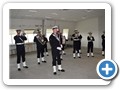 Svrnets Tamburkorps stillet op i trvejr